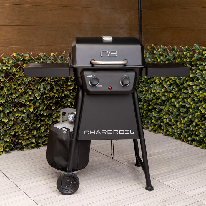 Black Char-Broil gas grill with side shelves and wheels.