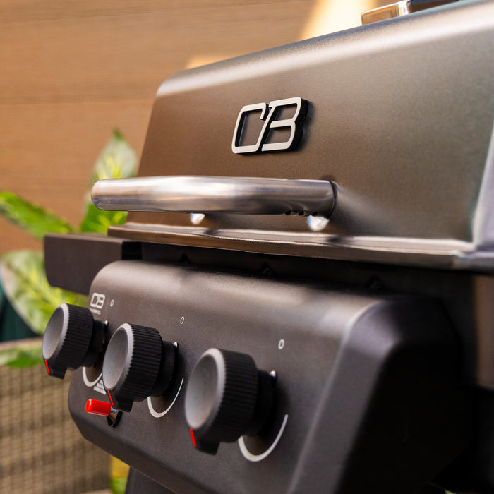 Brown C3 portable gas grill with black control knobs.