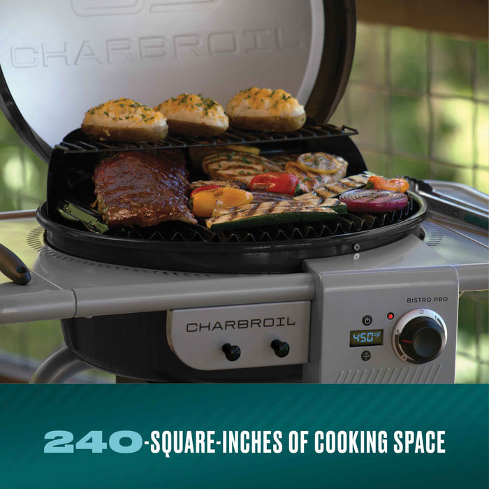 Silver Char-Broil Bistro Pro electric grill with charcoal mode, cooking assorted food.