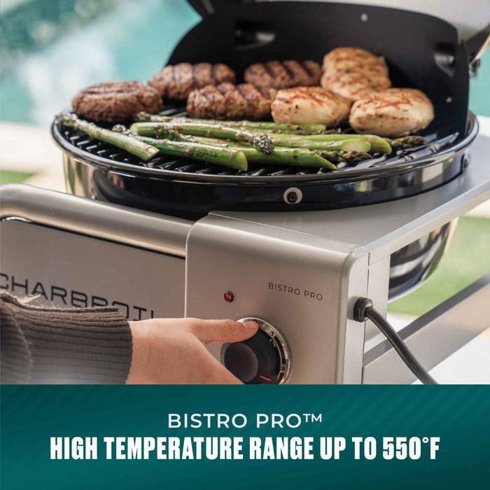 White Char-Broil Bistro Pro electric grill with asparagus and burgers cooking on the grill.