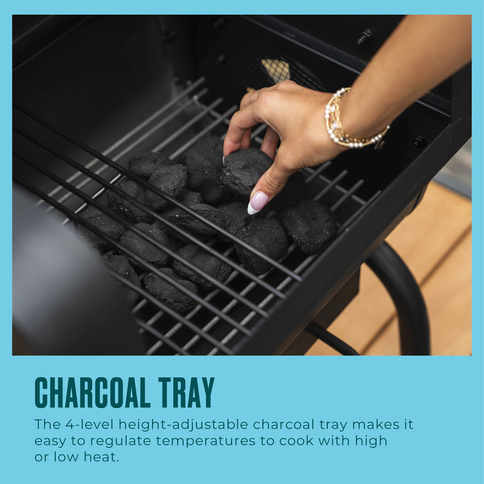 Black charcoal tray with adjustable height settings for optimal grilling.
