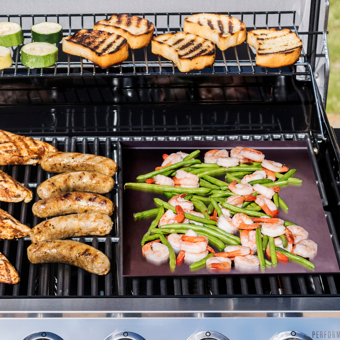 Grill with sausages, shrimp, green beans, and grilled bread.