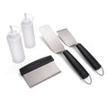 White squeeze bottles and black-handled spatulas with Char-Broil branding.