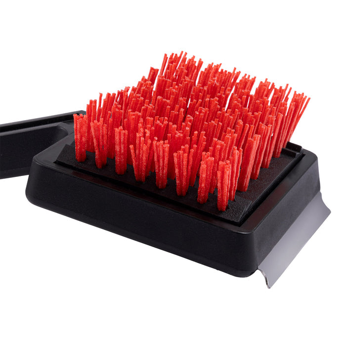 Red bristle brush with black base for cleaning.