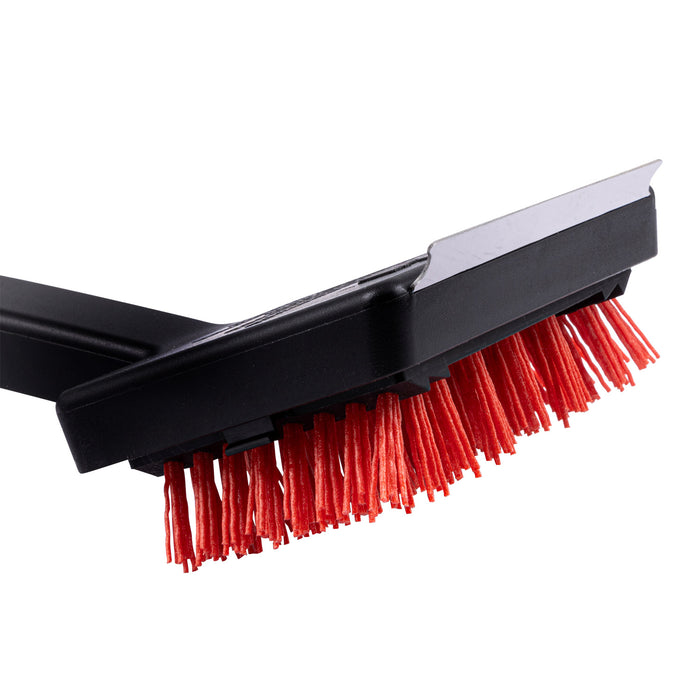 Black and red brush with white edge, likely for cleaning or grooming.