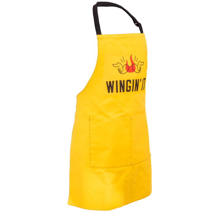 Yellow apron with "WINGIN' IT" text and flaming wings graphic.
