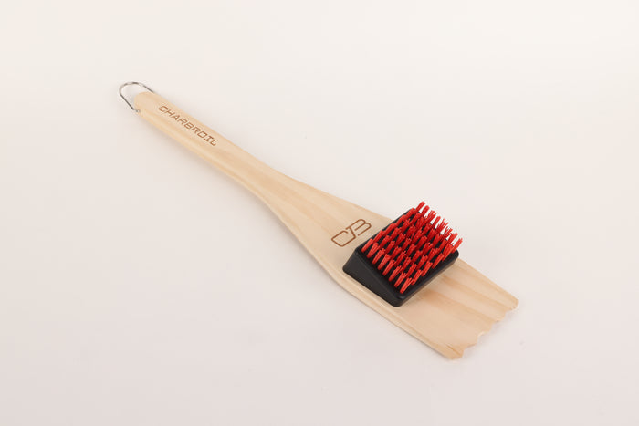Wood-handled Char-Broil grill brush with red bristles.
