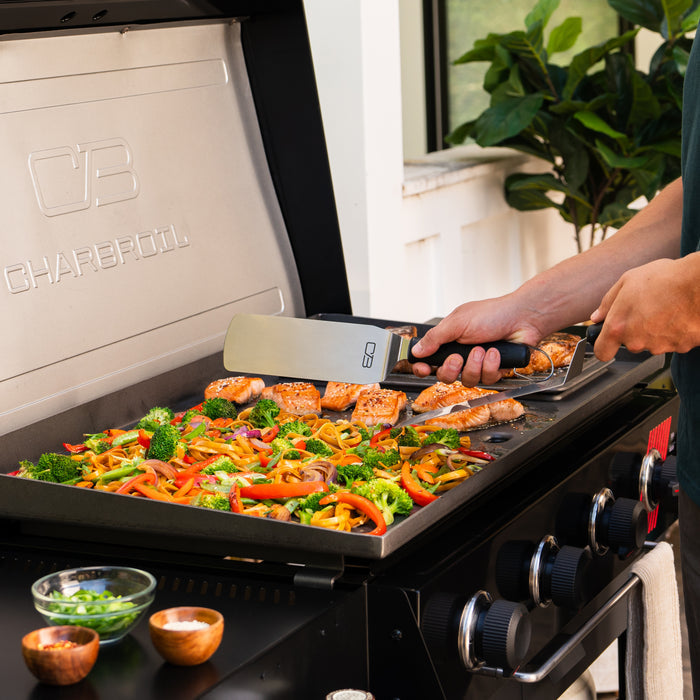 Char-Broil electric grill with salmon and vegetables cooking.