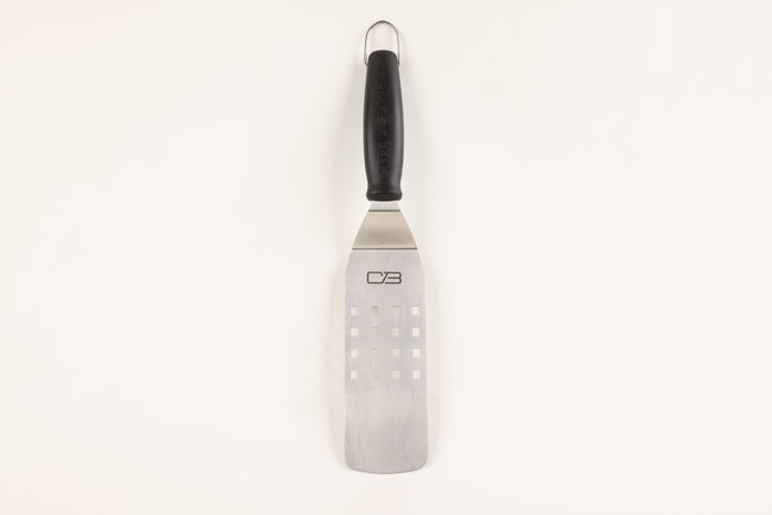 Black-handled spatula with stainless steel blade and CB logo.