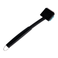 Black electric toothbrush with green bristles and "Braun" branding.