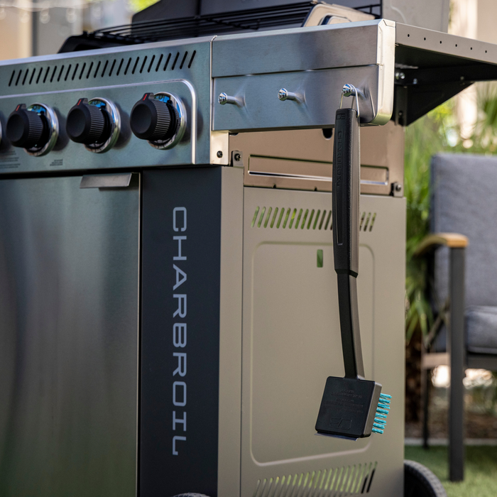 Gray Char-Broil electric grill with control knobs and side shelf.