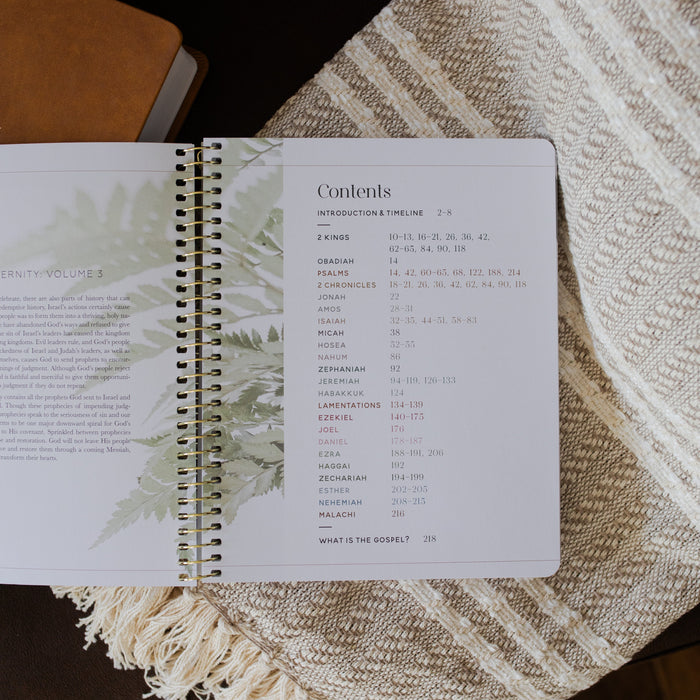 Eden to Eternity Spiral opened to the content section on a textured blanket
