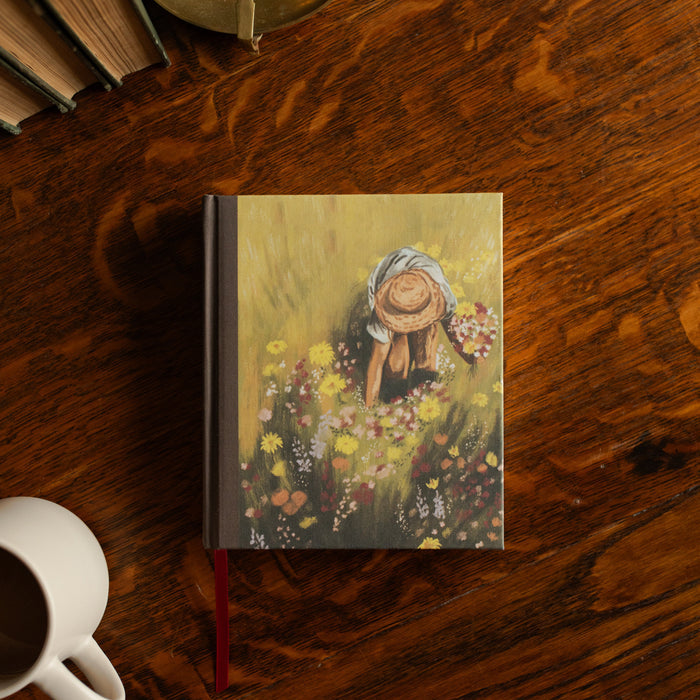 ESV journaling Fields Bible cover on a wooden table next to a white coffee cup