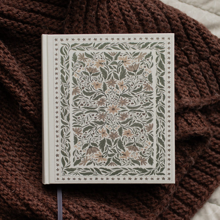 The ESV Bible Roman cover on a brown blanket