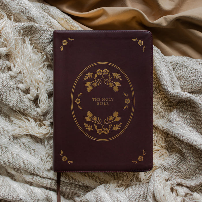 leather bible with gold etching cover on a textured blanket
