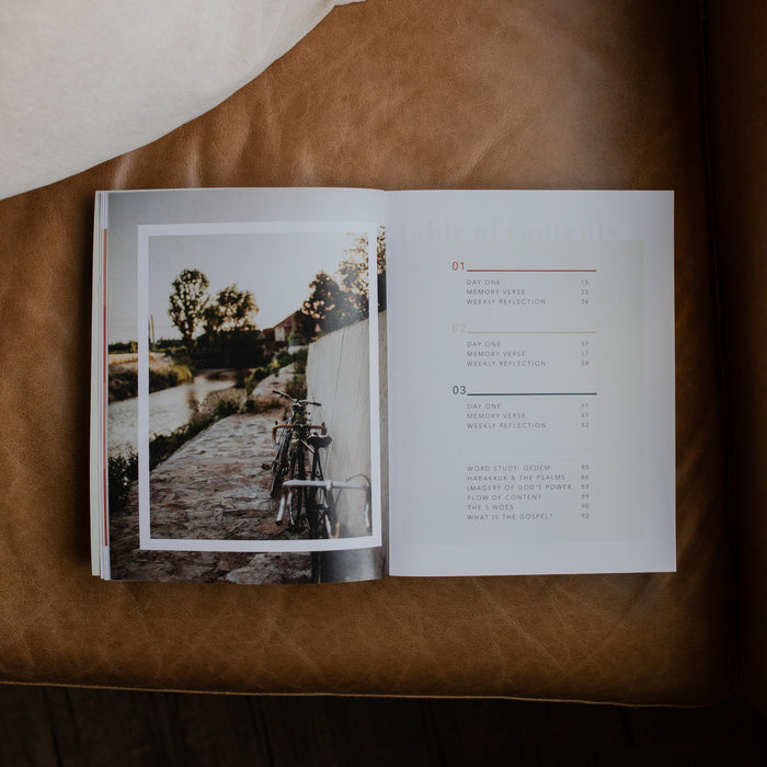 Even If Study opened to the table of contents page on a leather couch