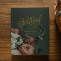 Faithful matte book on a wooden table next to an open bible