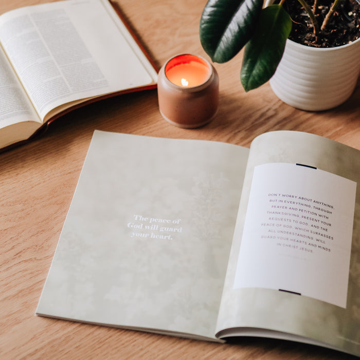 Fighting with Faith study opened to the The Peace of God will guard our heart section on a wooden table