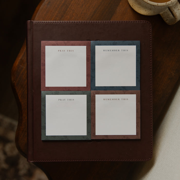 Four stacks of Floral Border Sticky Notes next to each other on a closed bible