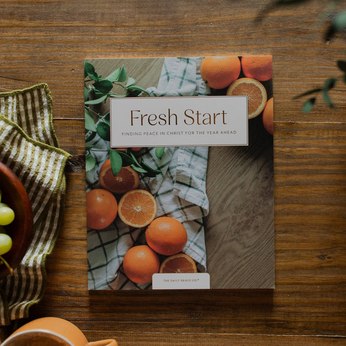 Fresh Start Bible study cover on a wooden table next to a bowl of grapes and a coffee cup