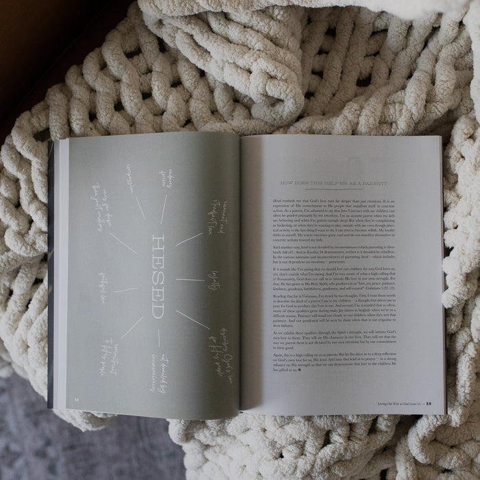 Gospel at Home Issue 7 opened to the Hessed devotional page on a white knitted blanket