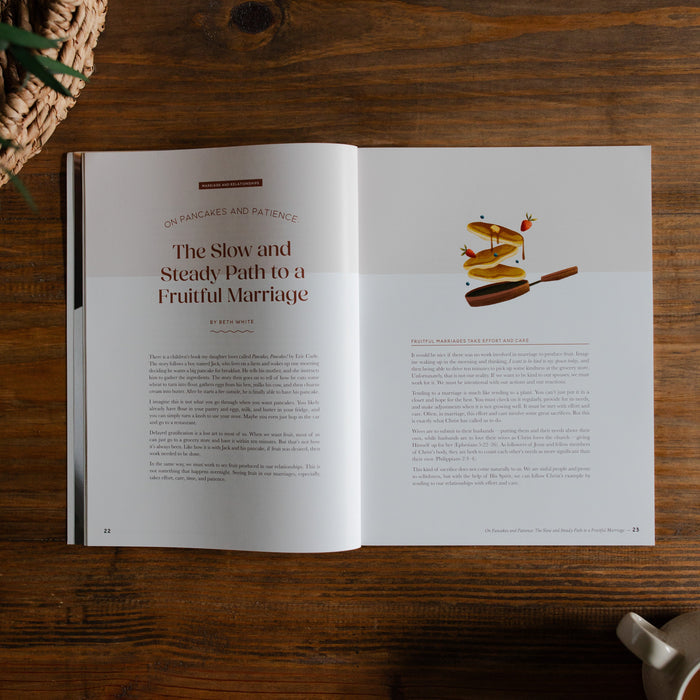 Gospel at Home Issue 8 opened to the slow and steady path to a fruitful marriage Page on a wooden table next to a coffee cup and a woven basket