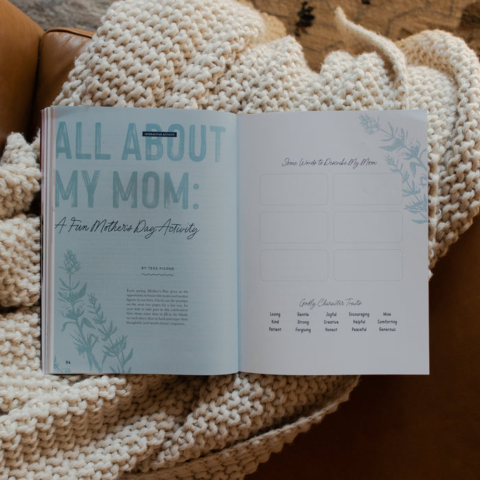 Gospel at Home Issue 11 opened to the All About My Mom page on a white knitted blanket