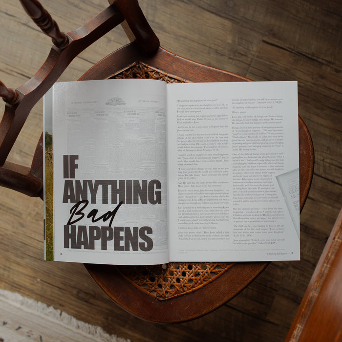 Open book with text 'IF ANYTHING Bad HAPPENS' on a wooden surface