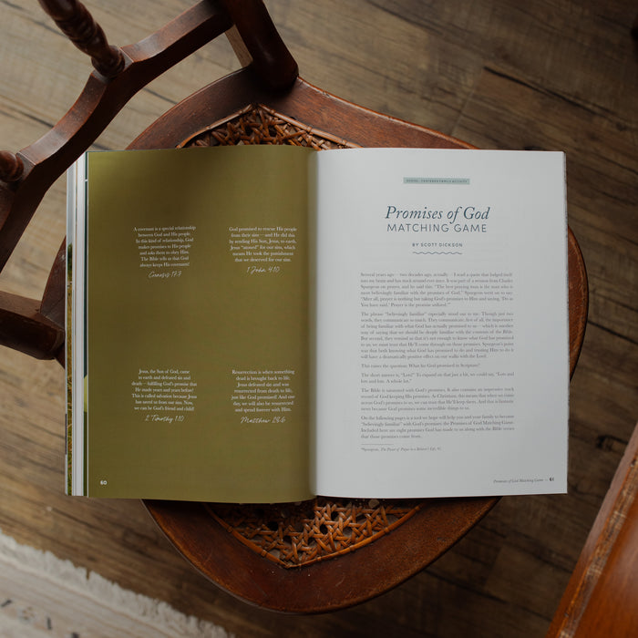 Open book on a wooden chair with text visible