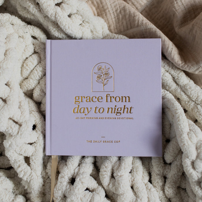 Grace from Day to Night a 40 day morning and evening devotional laying on a blanket