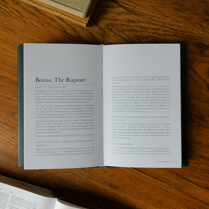 Open book on a wooden surface with text visible