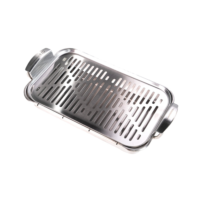 Silver stainless steel grill pan with handle and slotted cooking surface.