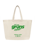 A natural canvas tote bag with long handles features green text reading "the grüns bodega," along with "1(855)GET-GRÜNS" and small icons of a plant, bear, and sun, shown on a white background.