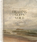 A spiral-bound book or journal cover featuring a seascape painting with the title 'HEARING GOD'S VOICE' and the subtitle 'Learning to Be Led by God.' The bottom text reads 'THE DAILY GRACE CO.