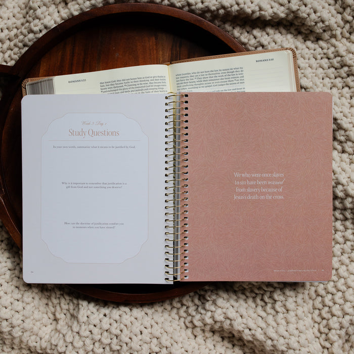 In Christ Alone Study opened to the Week 3 and Day 1 Study Questions page on an open Bible on a wooden tray on a knitted blanket