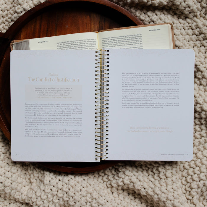 In Christ Alone Study opened to the Reflection page on an open Bible on a wooden tray on a knitted blanket