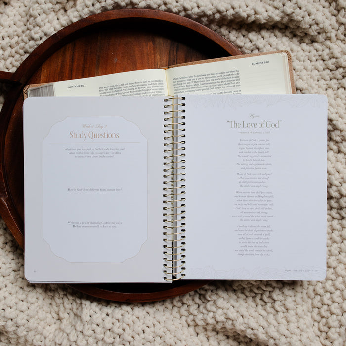 In Christ Alone Study opened to the Week 4 and Day 3 Study Questions page on an open Bible on a wooden tray on a knitted blanket