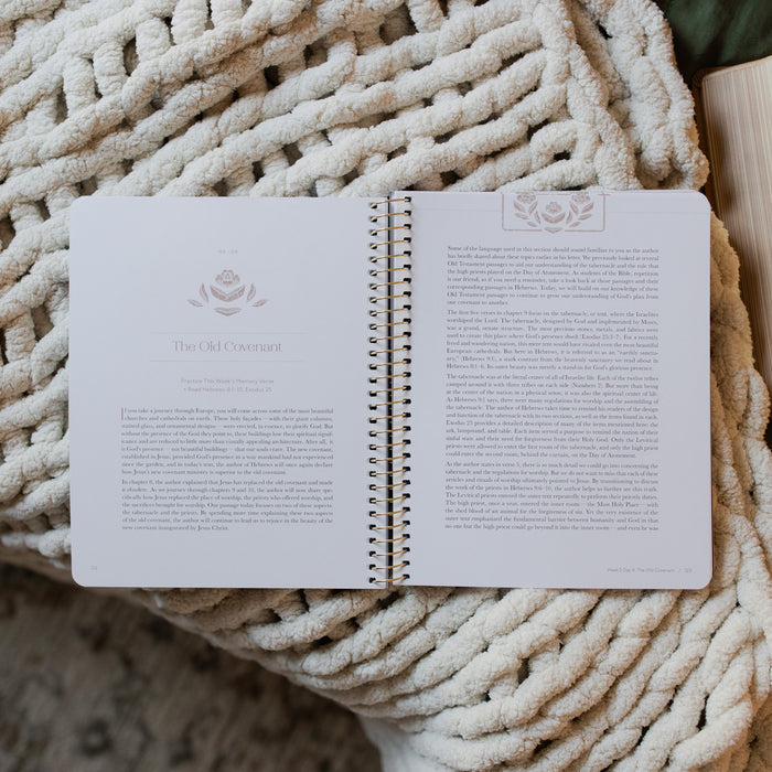 Jesus is Better study opened to the old covenant page laying on a white knitted blanket