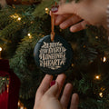 A woman holding the A Joy of Every Longing Heart Ornament