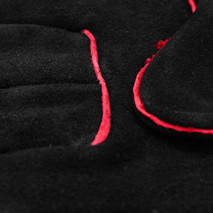 Black fabric with red stitching detail.
