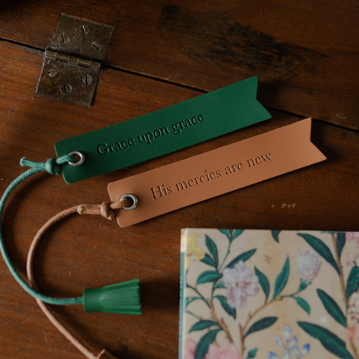 The Leatherette Bookmarks on a wooden table