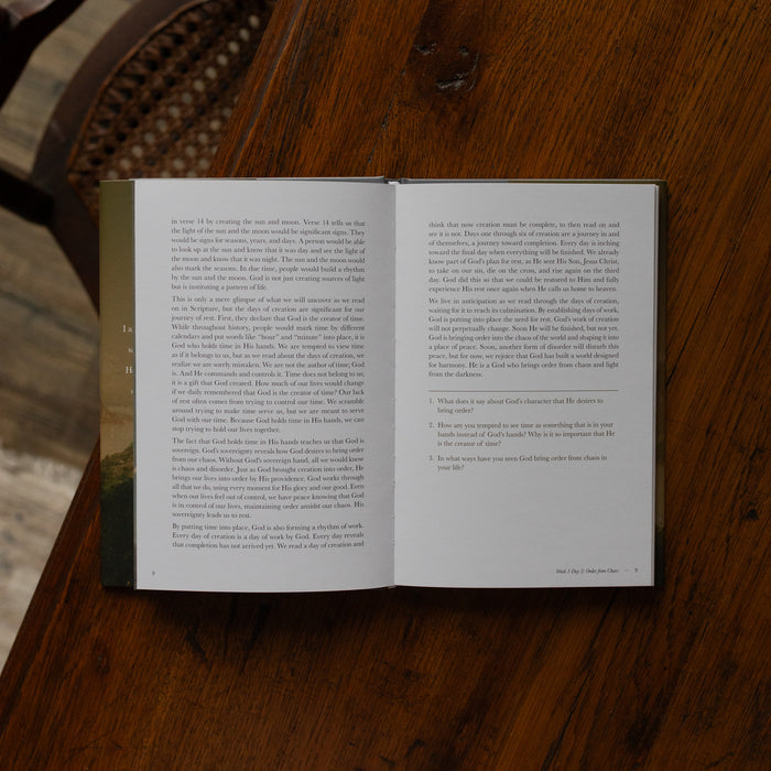 Made for Him book opened to the ending of Week 1 Day 2 reading page on a wooden table near a chair