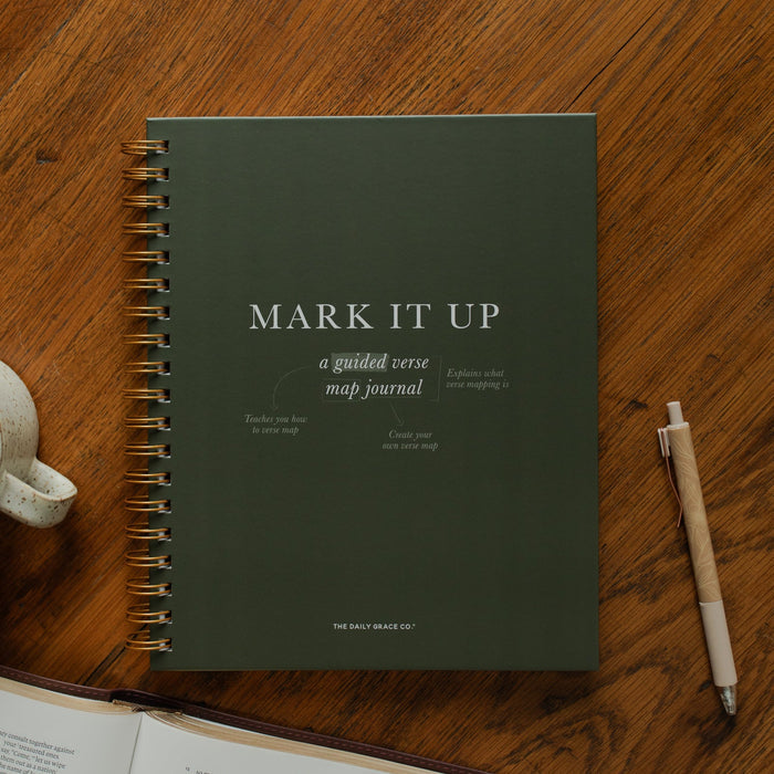 Mark It Up Journal cover next to a pen and a coffee cup