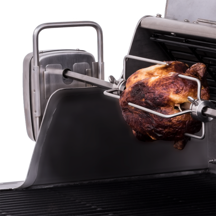 Rotisserie oven with a golden-brown roasted chicken on a metal spit.