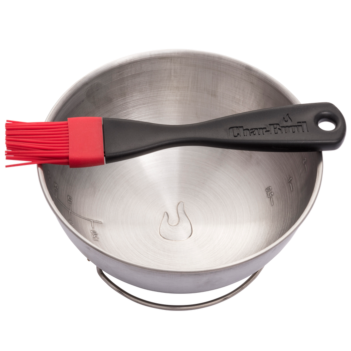 Red silicone brush in silver Char-Broil mixing bowl.