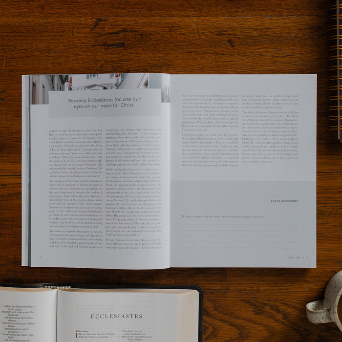 The Path to Purpose opened to the Study Questions page on a wooden table near an open bible