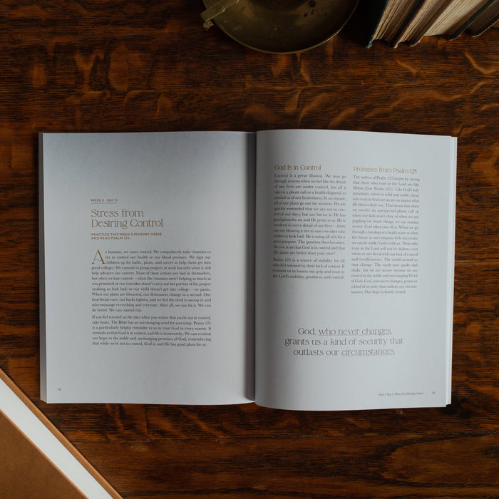 Peace Under Pressure Study opened to the stress from desiring control page on a wooden table