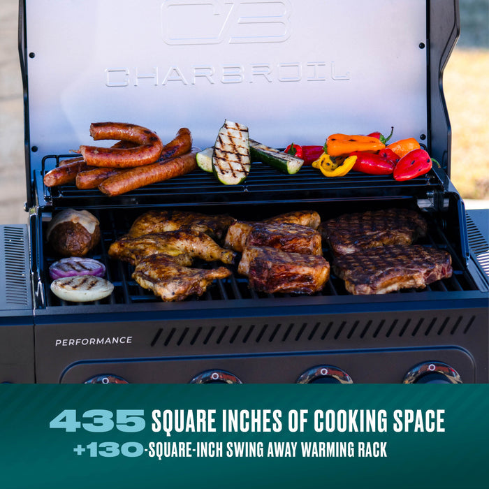 Char-Broil Performance grill with 435 square inches of cooking space, cooking sausages, steak, and vegetables.