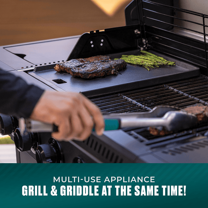 Multi-use black grill and griddle combo cooking steak and asparagus.