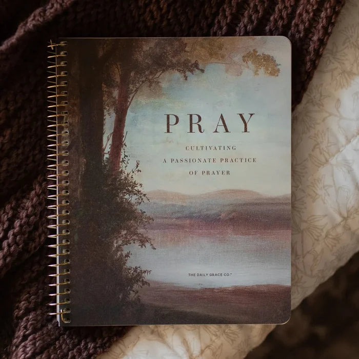 The Pray spiral study cover on a woven blanket